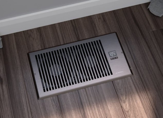 Impulsor de aire instalado en la rejilla de ventilación del piso